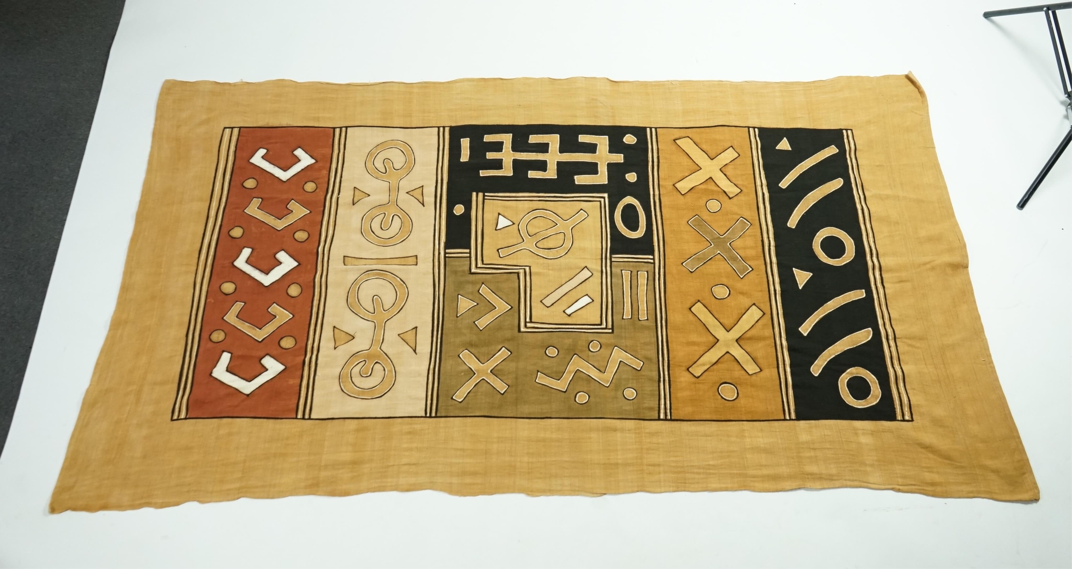 A collection of five 20th century African Congo hand woven and embroidered raffia palm leaf runners and mats, together with a later large printed hanging. 260cm x 138cm. Condition - one smaller mat has a hole in the weav